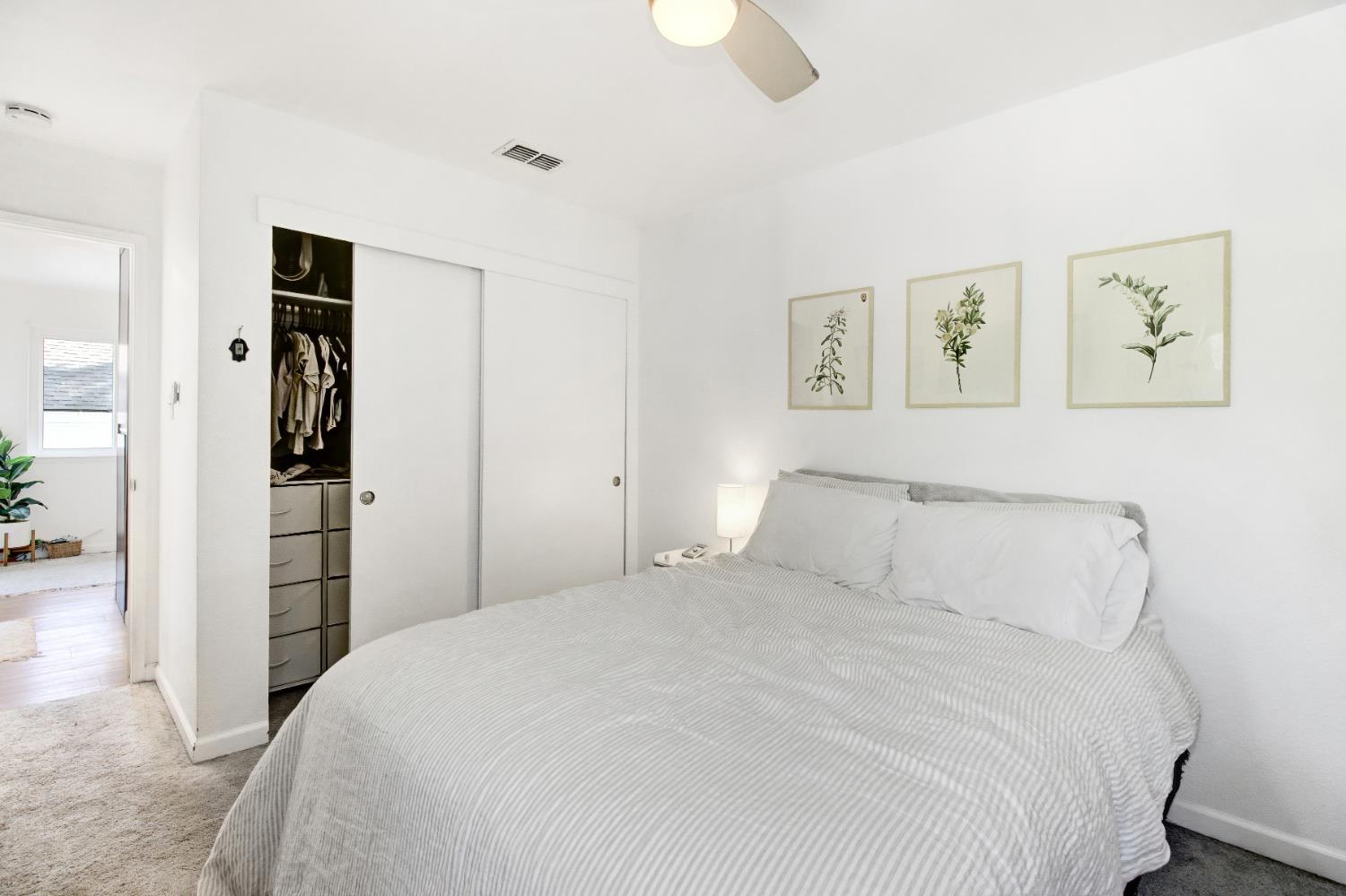 1916 17th Street Sacramento, CA 95811 - Photo 17 of 33 a bedroom with a large bed and closet