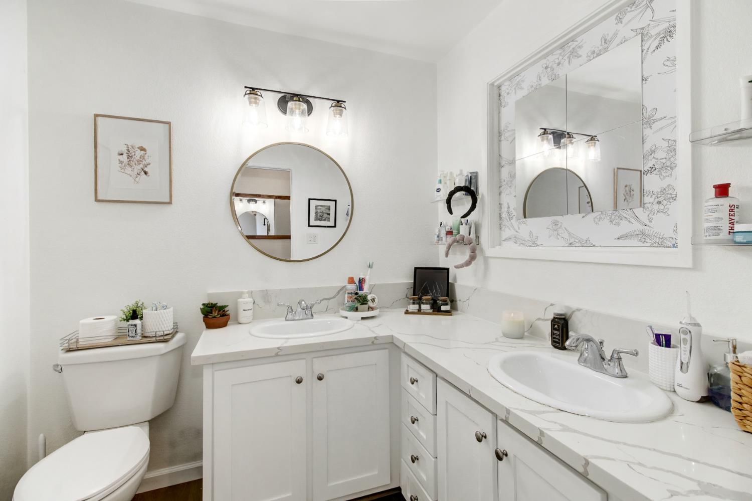 1916 17th Street Sacramento, CA 95811 - Photo 18 of 33 a bathroom with a toilet sink and mirror