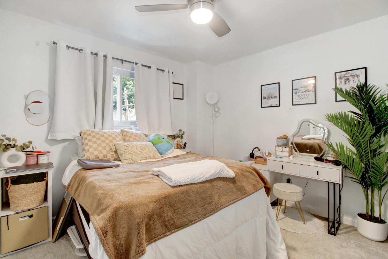 1916 17th Street Sacramento, CA 95811 - Photo 21 of 33 a bedroom with a bed and a chandelier