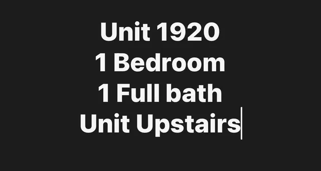 a bedroom with a bed and a chair