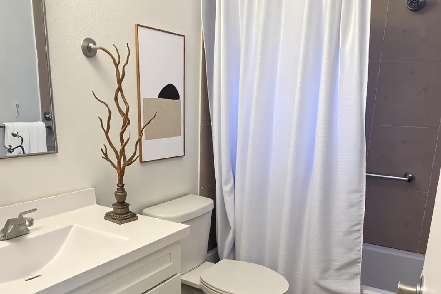 1916 17th Street Sacramento, CA 95811 - Photo 31 of 33 a bathroom with a sink toilet and mirror