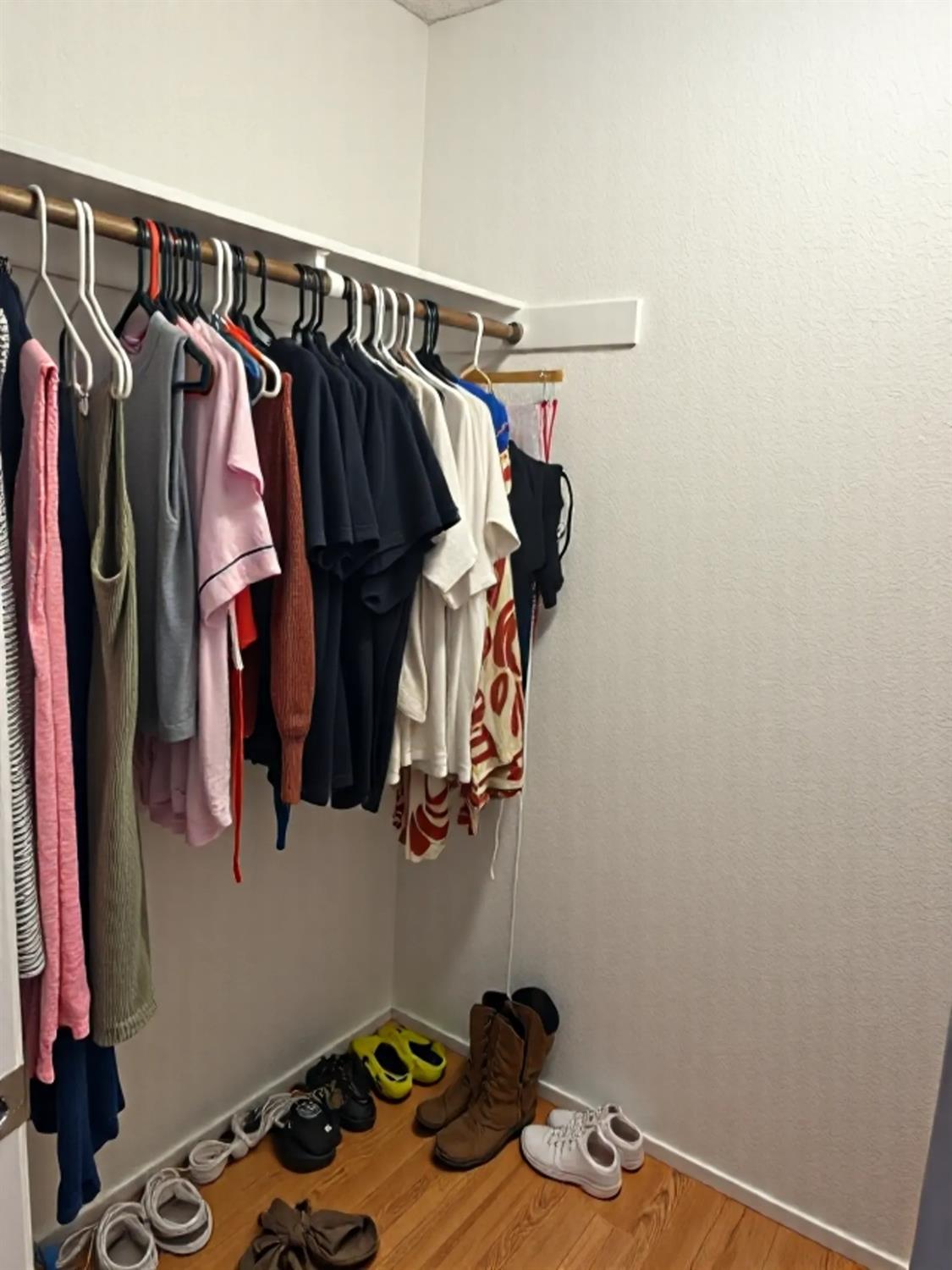 1916 17th Street Sacramento, CA 95811 - Photo 32 of 33 a view of walk in closet with clothes and shoes