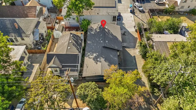 an aerial view of residential houses with outdoor space