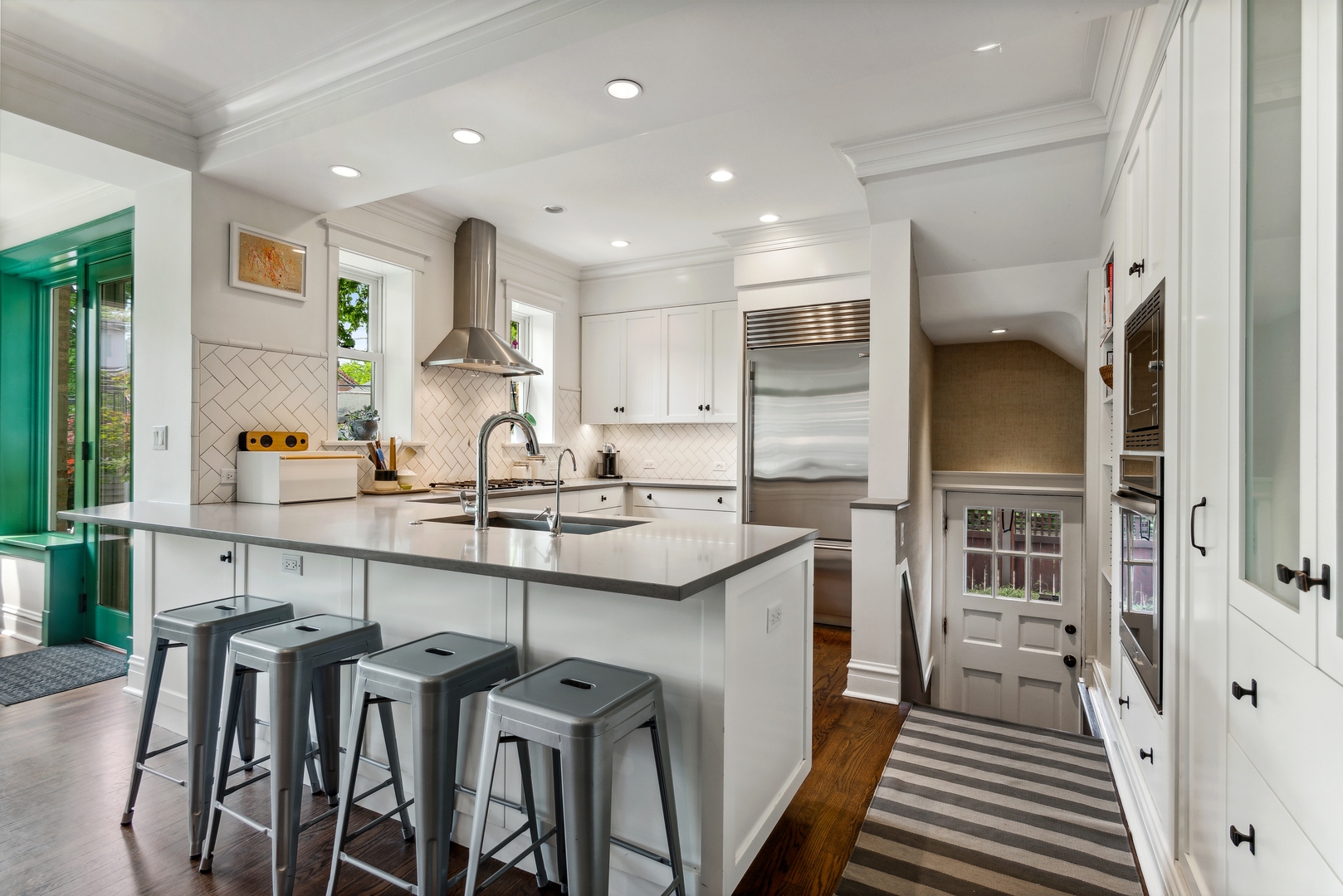 1465 West Cullom Avenue Chicago, IL 60613 - Photo 12 of 54 a kitchen with cabinets and chairs