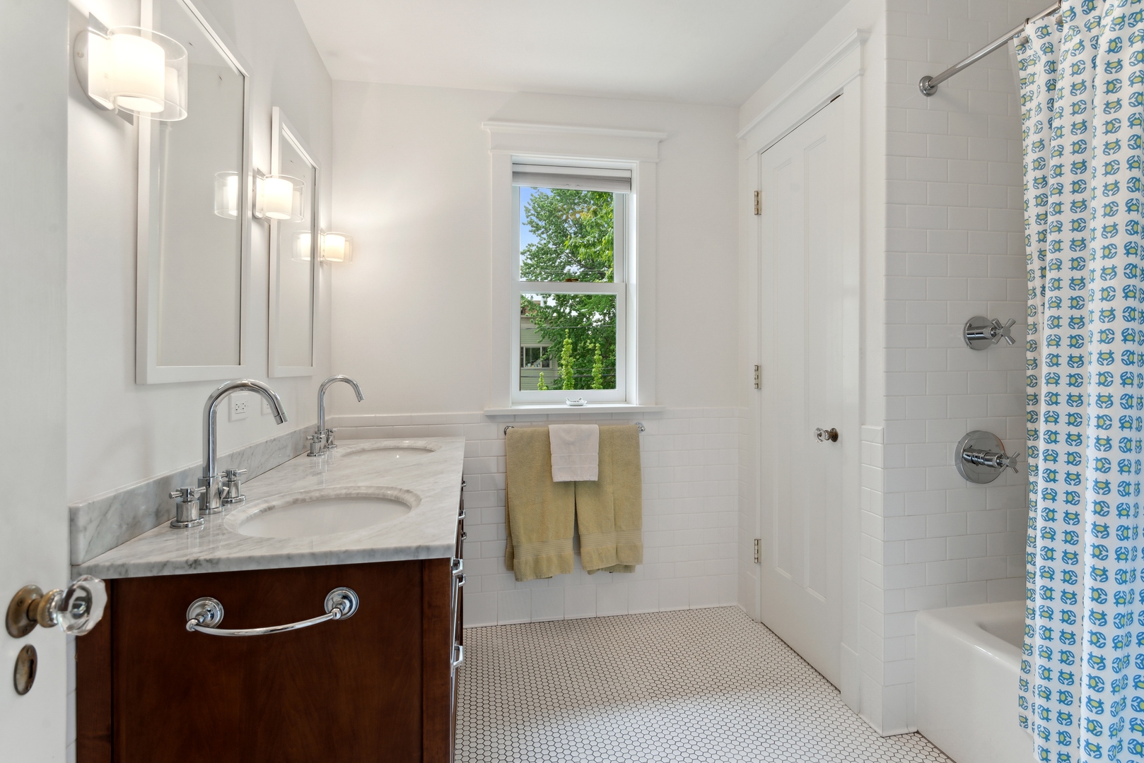 1465 West Cullom Avenue Chicago, IL 60613 - Photo 30 of 54 a bathroom with a sink and a mirror