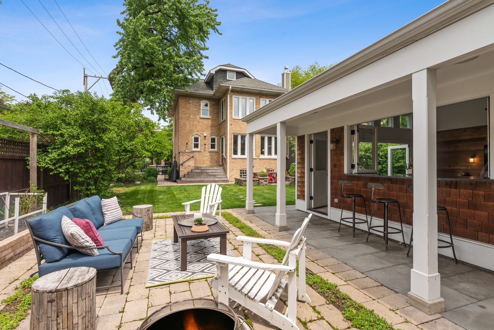 1465 West Cullom Avenue Chicago, IL 60613 - Photo 45 of 54 a view of a patio with table and chairs and potted plants