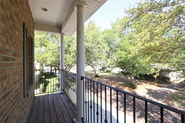 a view of a porch with wooden floor and outdoor space