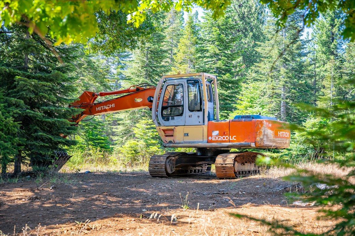 30100 Foresthill Road Foresthill, CA 95631 - Photo 81 of 89 a backyard of a house with barbeque oven table and chairs