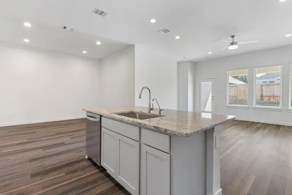 a kitchen with sink and window