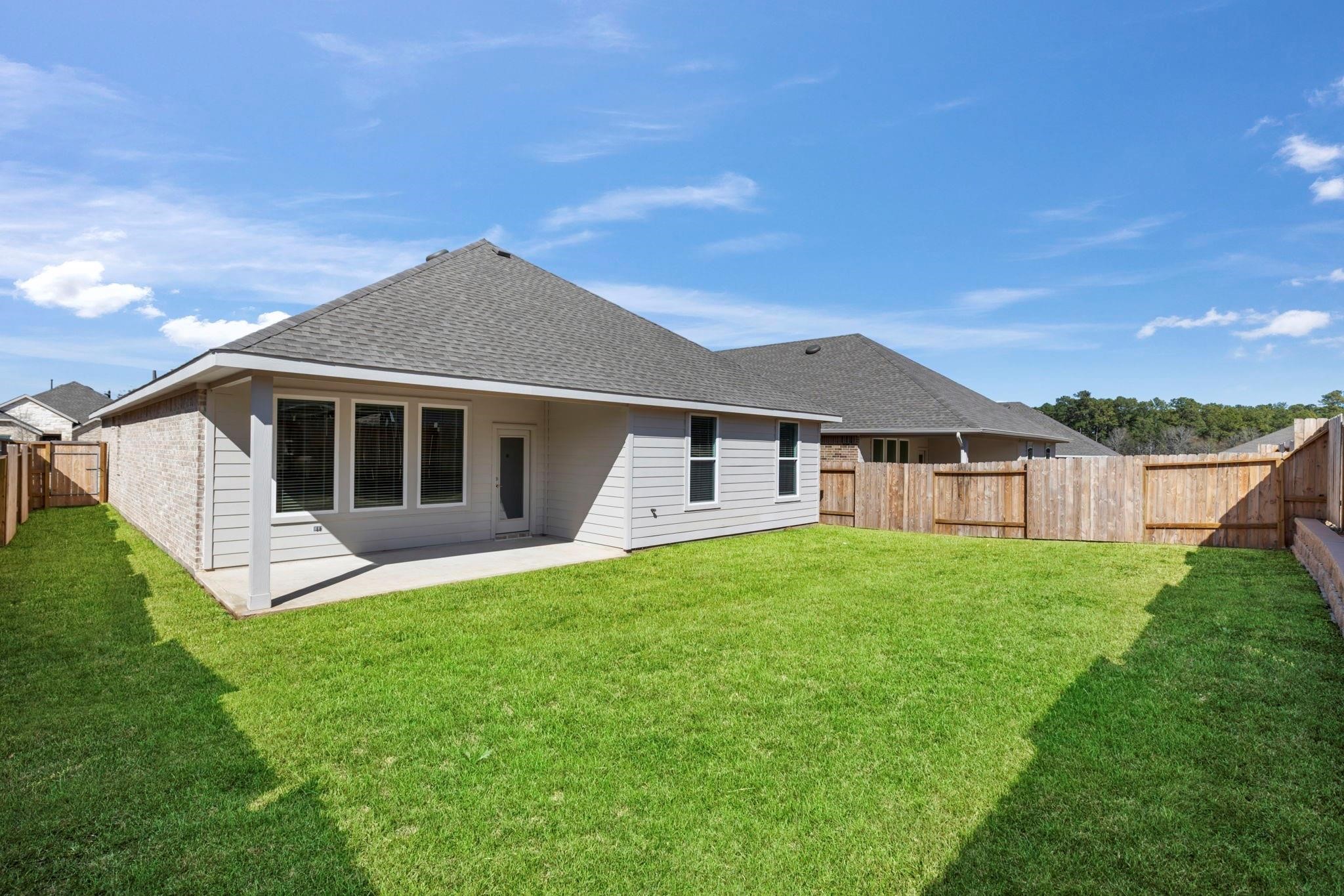 1644 Little Rabbit Court Montgomery, TX 77316 - Photo 2 of 27 a big house with a big yard and more windows
