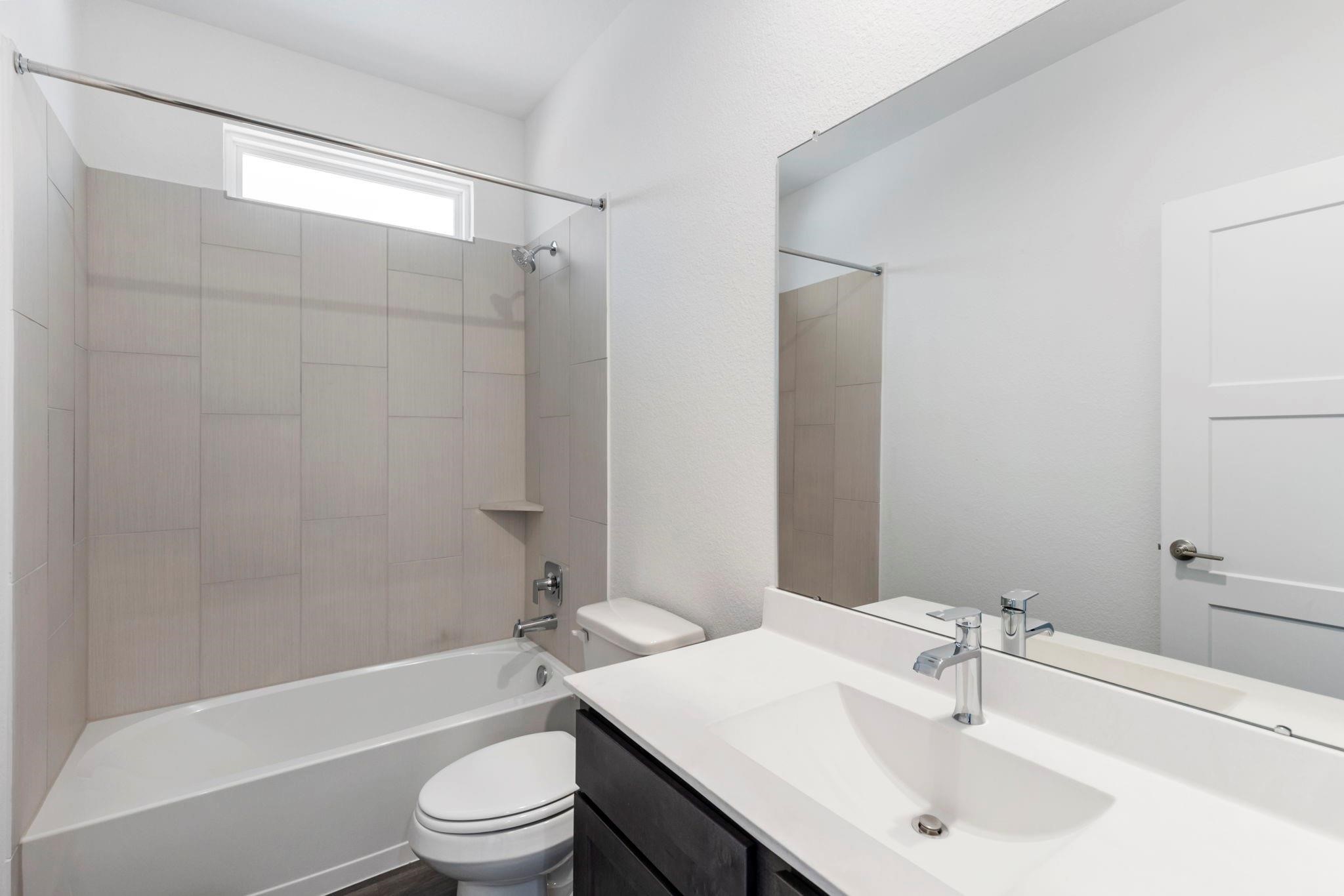 1644 Little Rabbit Court Montgomery, TX 77316 - Photo 24 of 27 a bathroom with a sink a toilet and shower