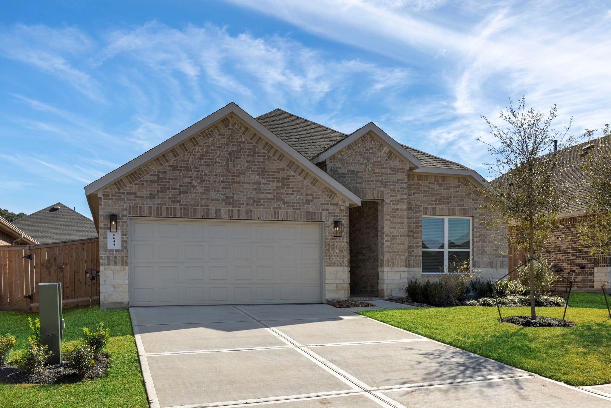 1644 Little Rabbit Court Montgomery, TX 77316 - Photo 27 of 27 a house view with a garden space