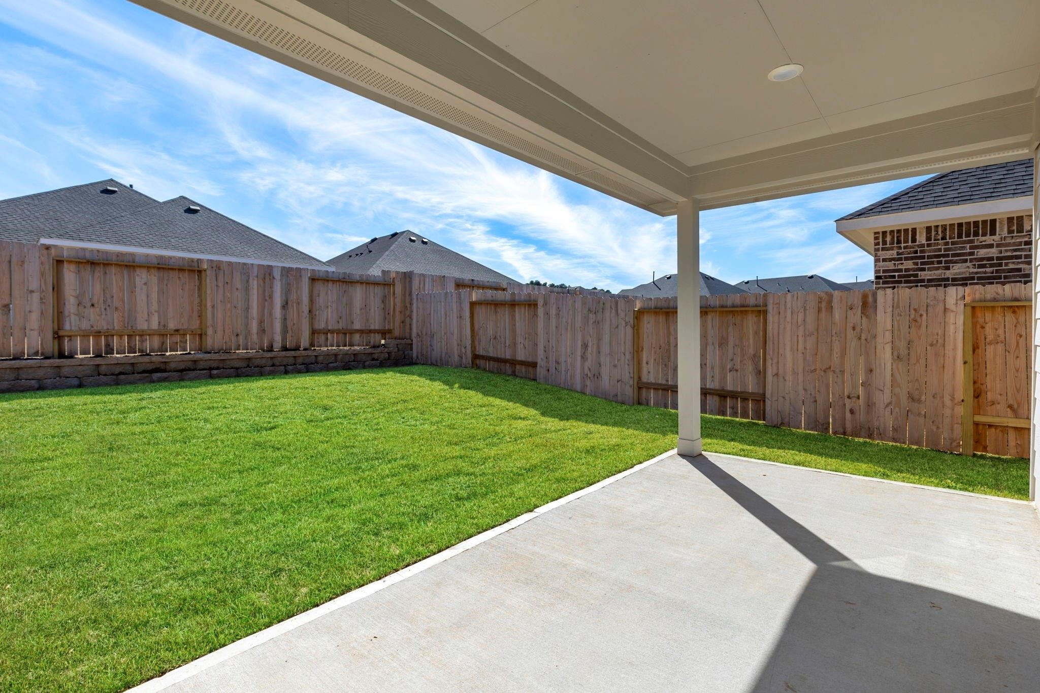 1644 Little Rabbit Court Montgomery, TX 77316 - Photo 4 of 27 a view of a back yard of the house