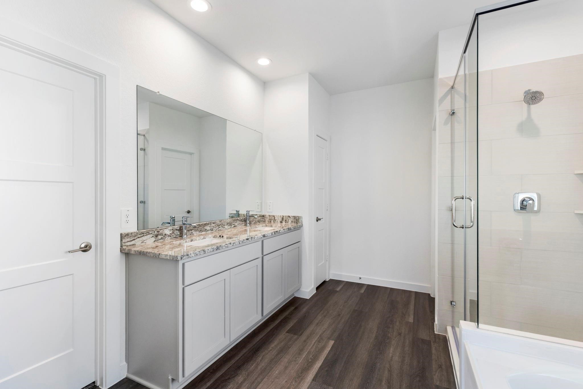 1644 Little Rabbit Court Montgomery, TX 77316 - Photo 6 of 27 a bathroom with a sink and mirror with shower