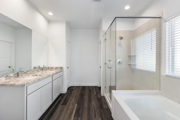 a bathroom with a sink a mirror and a bathtub