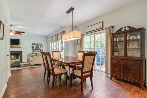a kitchen with kitchen island granite countertop a sink stainless steel appliances and a counter space