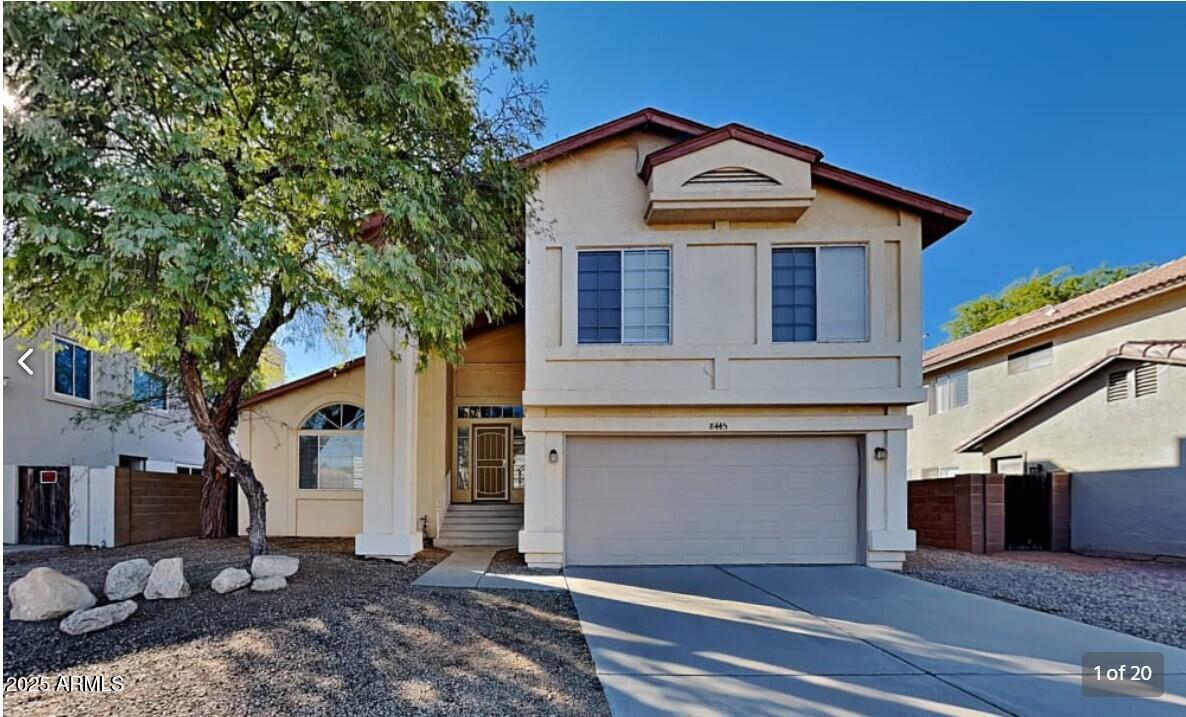 a front view of a house with a garage