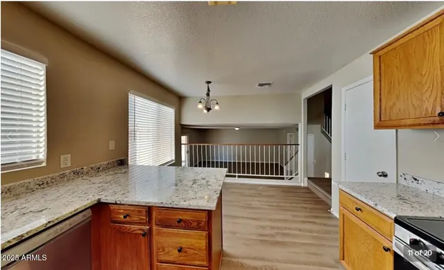 a view of a kitchen cabinets a sink and dishwasher