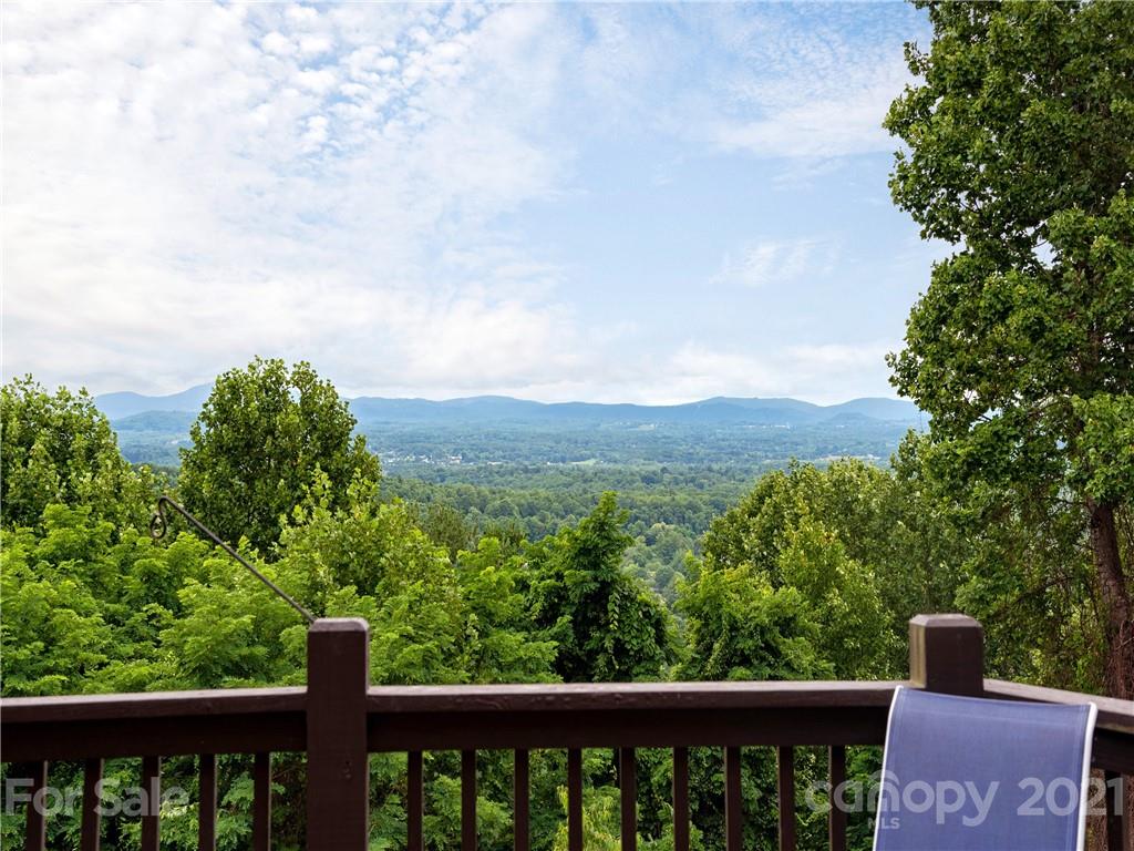 143 Country Ridge Road Hendersonville, NC 28739 - Photo 12 of 29 a view of a forest from a balcony