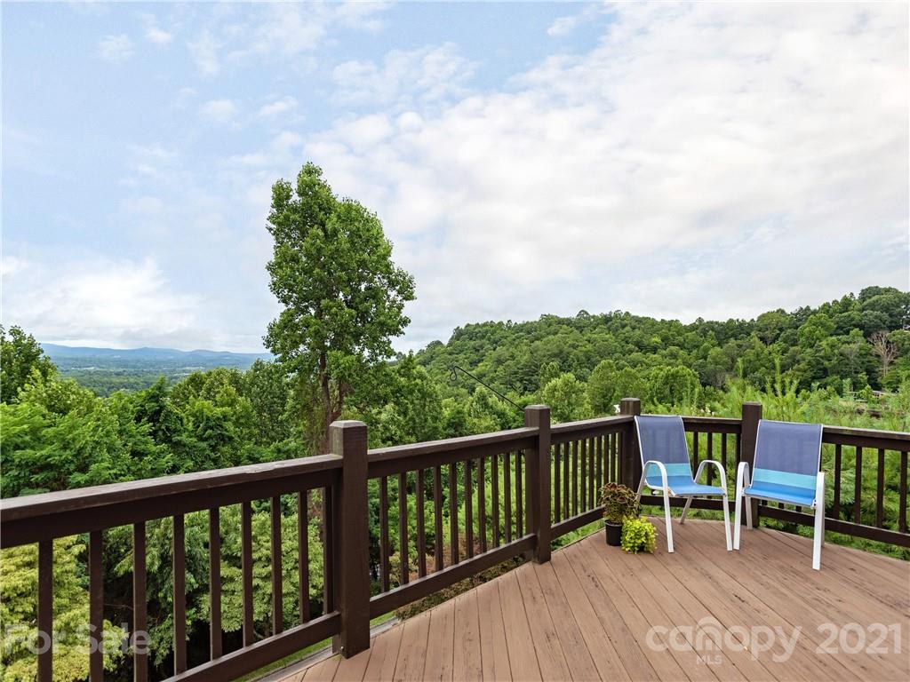 143 Country Ridge Road Hendersonville, NC 28739 - Photo 13 of 29 a view of a two chair with wooden floor
