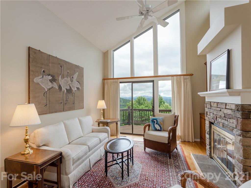 143 Country Ridge Road Hendersonville, NC 28739 - Photo 5 of 29 a living room with furniture and a fireplace
