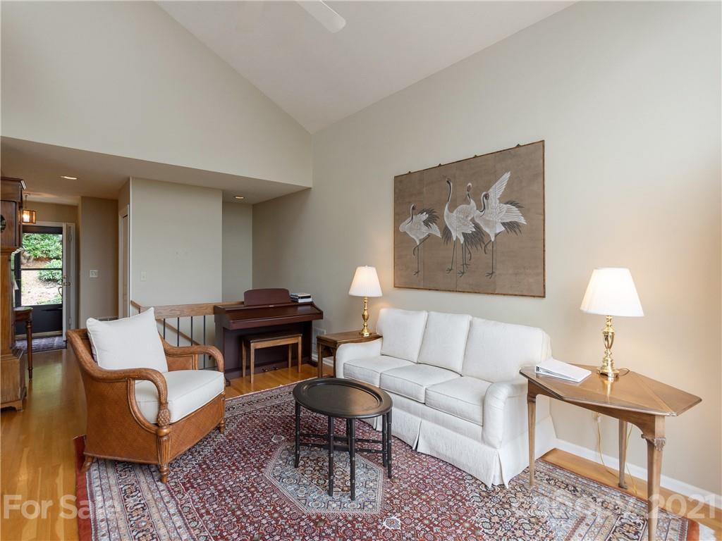 143 Country Ridge Road Hendersonville, NC 28739 - Photo 7 of 29 a living room with furniture lamp and a rug