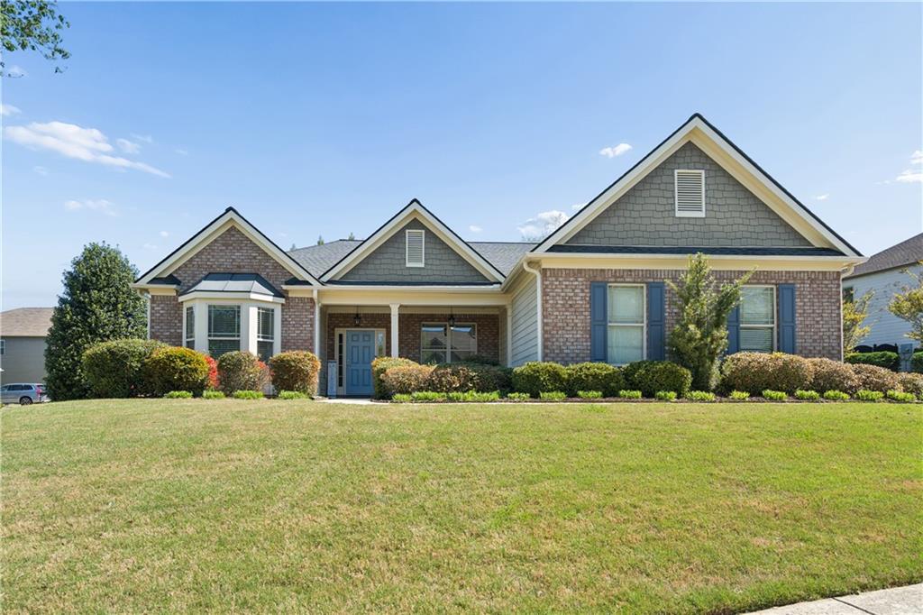 a front view of a house with a yard