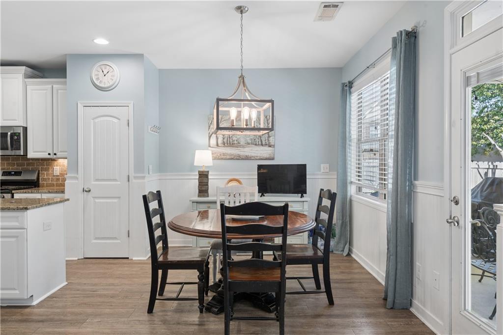 2467 Allsborough Way Dacula, GA 30019 - Photo 12 of 45 a view of a dining room with furniture window and wooden floor