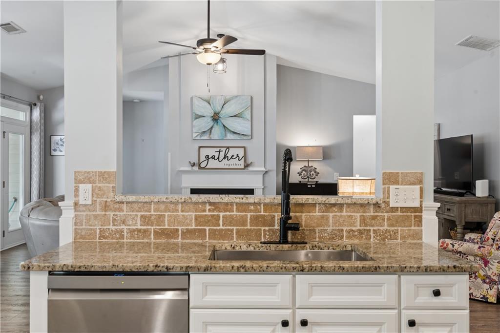2467 Allsborough Way Dacula, GA 30019 - Photo 16 of 45 a kitchen with stainless steel appliances granite countertop a sink and cabinets
