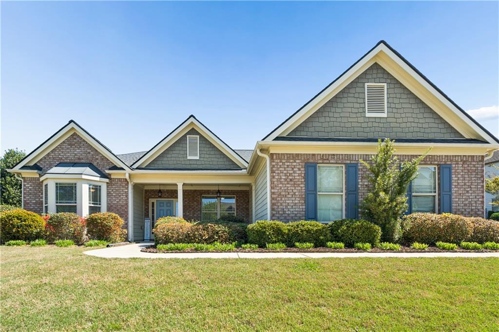 2467 Allsborough Way Dacula, GA 30019 - Photo 2 of 45 a front view of a house with a yard