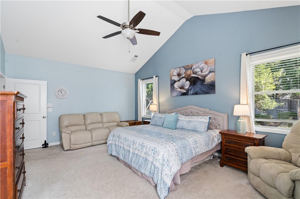 2467 Allsborough Way Dacula, GA 30019 - Photo 24 of 45 a bedroom with furniture and a large window
