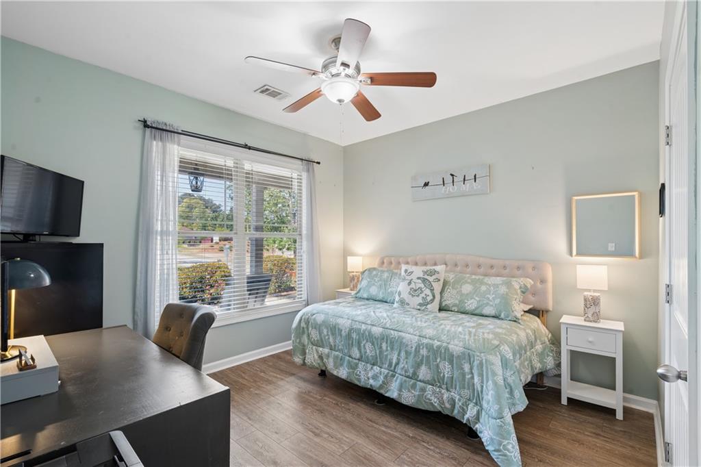 2467 Allsborough Way Dacula, GA 30019 - Photo 30 of 45 a bedroom with a bed and a desk