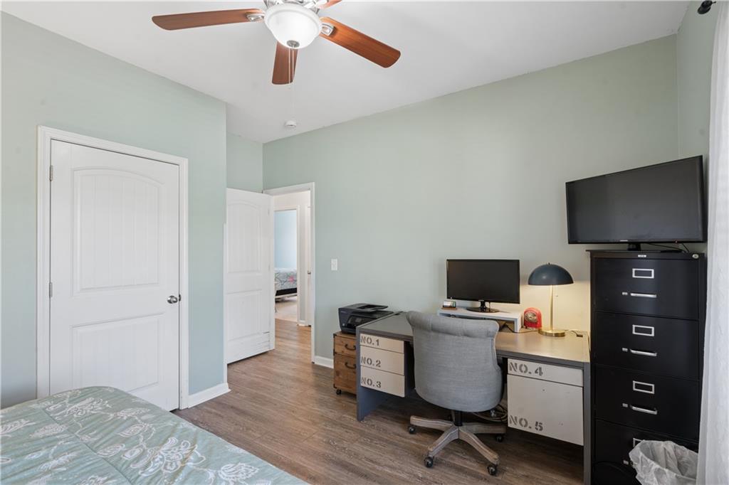 2467 Allsborough Way Dacula, GA 30019 - Photo 31 of 45 a view of a workspace with furniture and wooden floor
