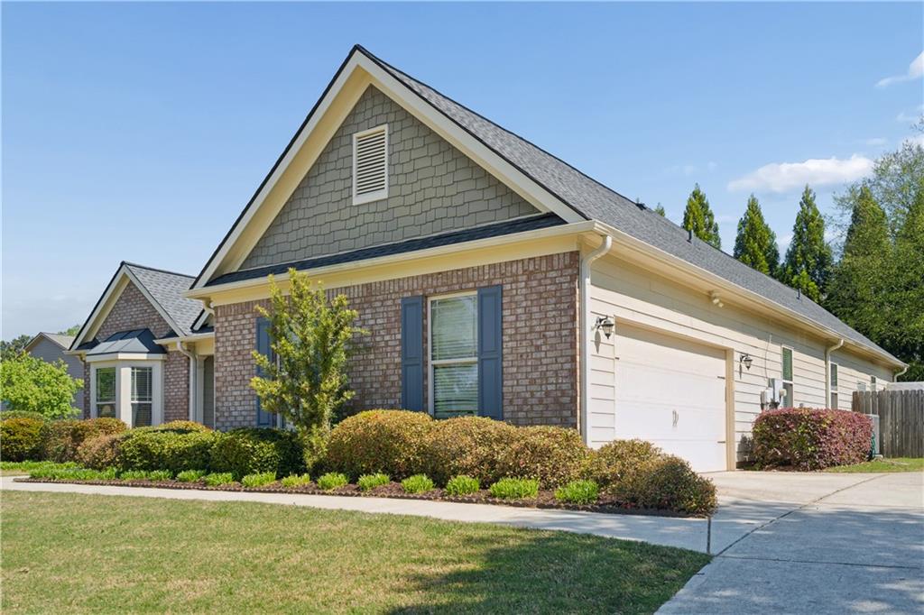 2467 Allsborough Way Dacula, GA 30019 - Photo 4 of 45 a front view of a house with a yard