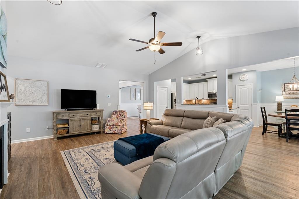 2467 Allsborough Way Dacula, GA 30019 - Photo 10 of 45 a living room with furniture and a flat screen tv