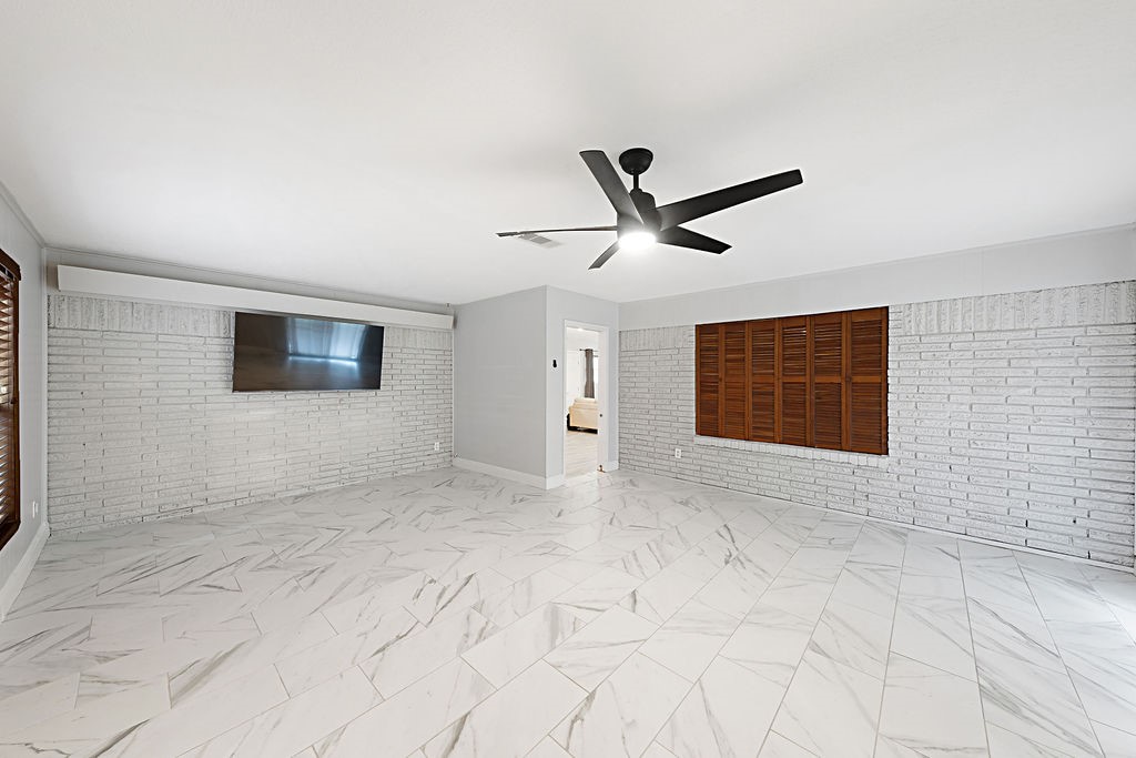 614 Gilpin Street Houston, TX 77034 - Photo 18 of 27 Another view of the large bonus room that also leads to the screened in porch.