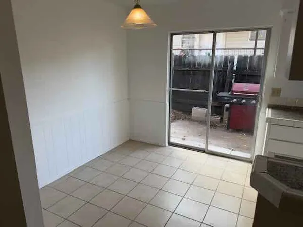 a view of an empty room and window