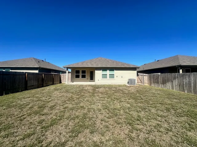 a house with yard in front of it