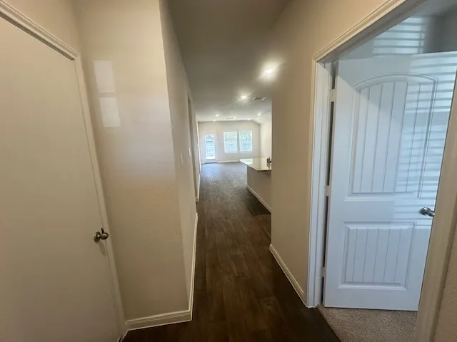 a view of a bathroom from the hallway