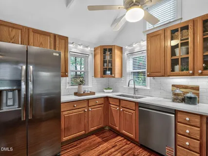 a kitchen with stainless steel appliances granite countertop a sink and dishwasher
