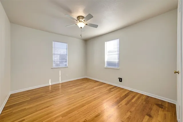 a bathroom with a granite countertop sink a toilet and bathtub
