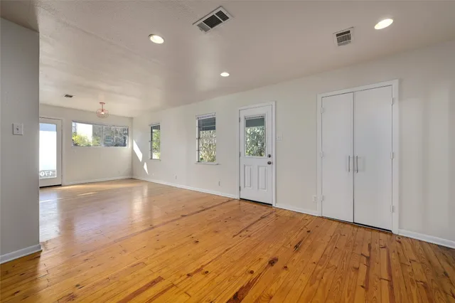 a kitchen with granite countertop a sink stove and refrigerator