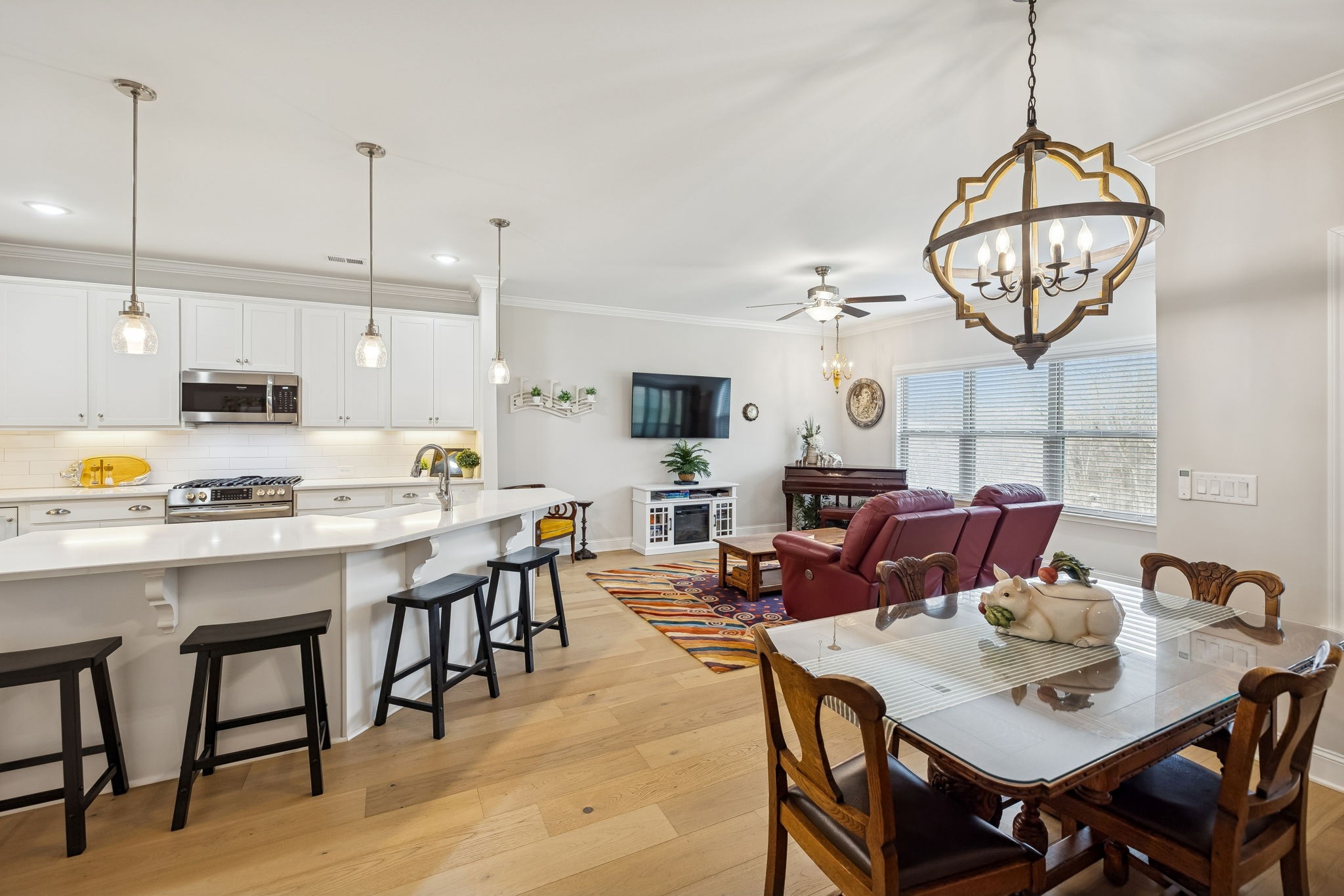 892 Meadow Crest Way Lebanon, TN 37090 - Photo 19 of 47 a view of a dining room and livingroom furniture a chandelier and wooden floor