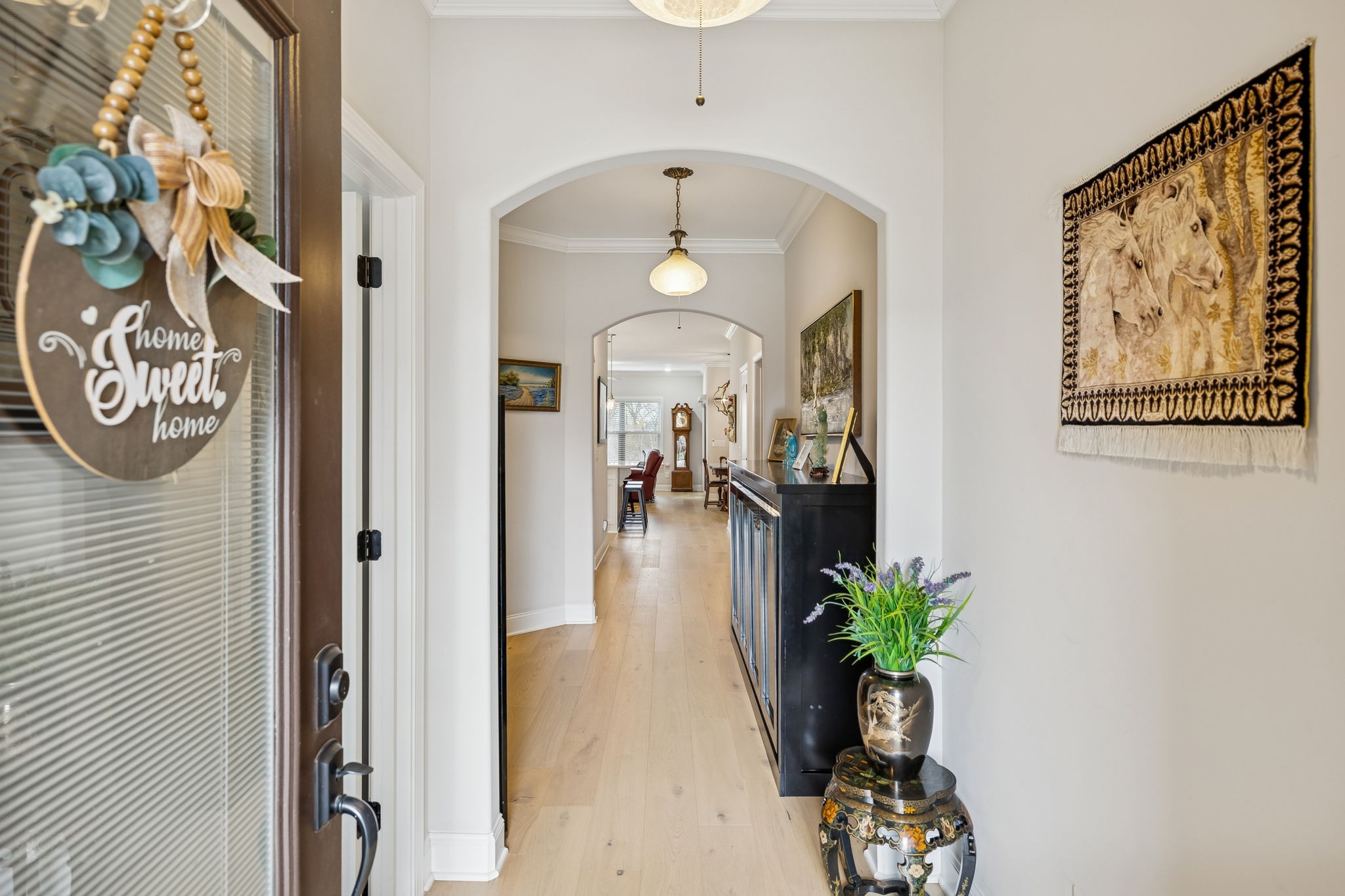 892 Meadow Crest Way Lebanon, TN 37090 - Photo 3 of 47 workspace with wooden floor and a chandelier