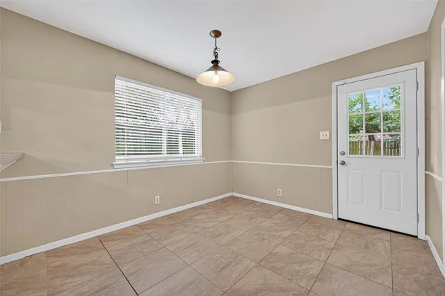 a view of empty room with windows