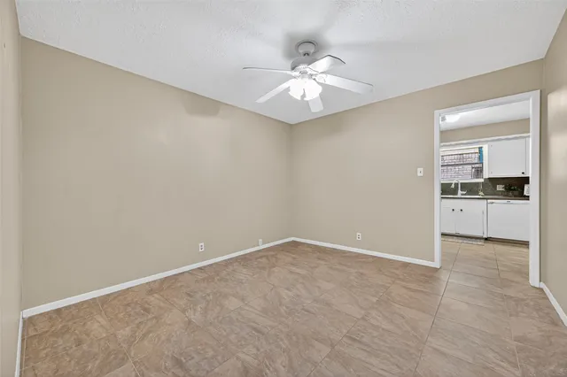 en empty room with kitchen and sink