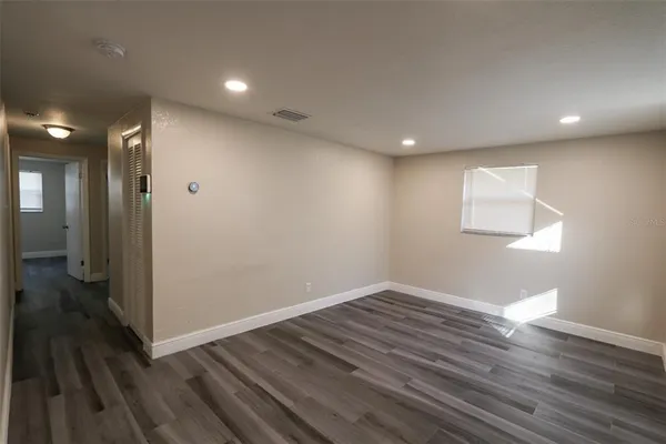 a kitchen with appliances a sink and cabinets