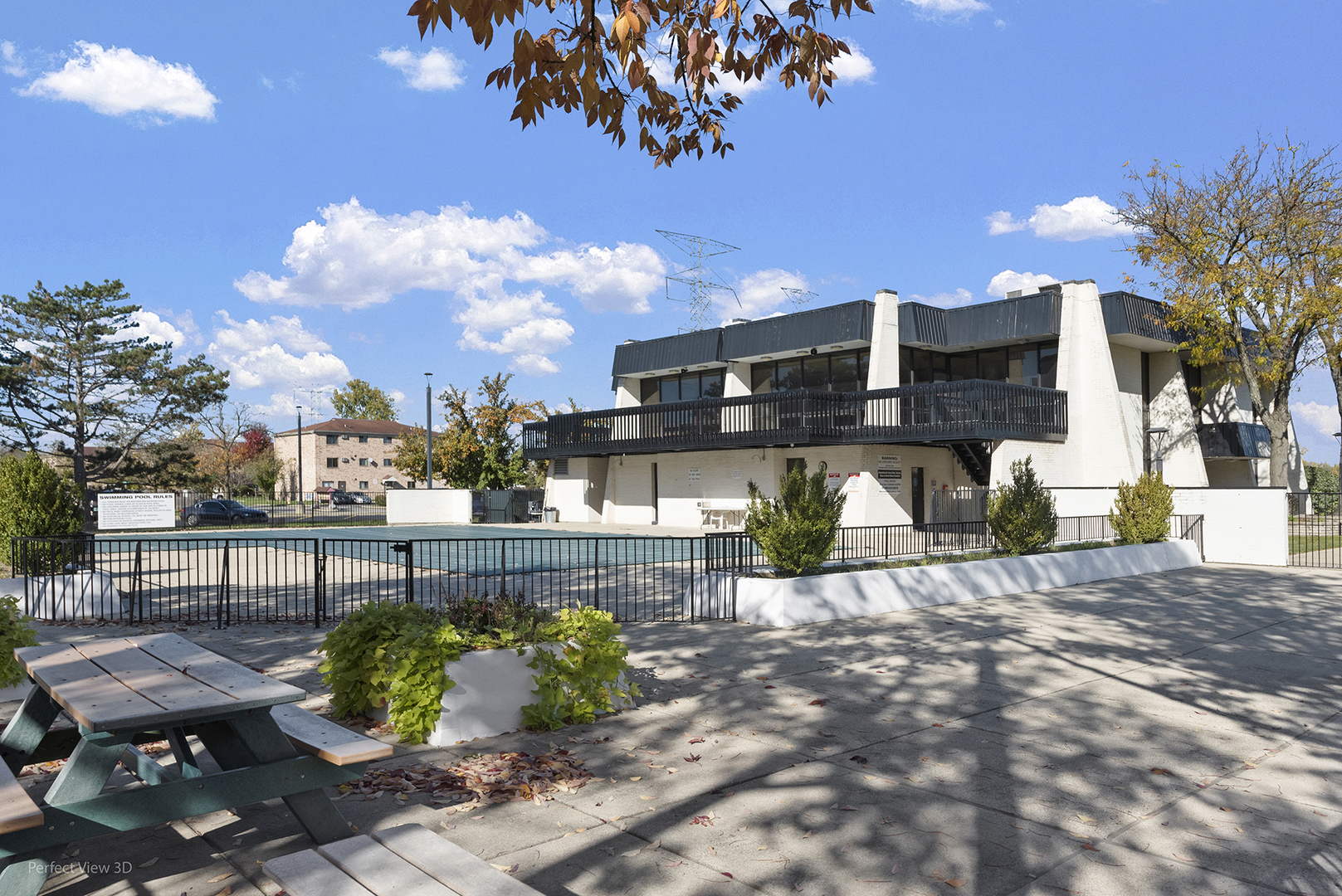 9701 North Dee Road, Unit 5E Niles, IL 60714 - Photo 16 of 18 a view of a chairs and table in the patio