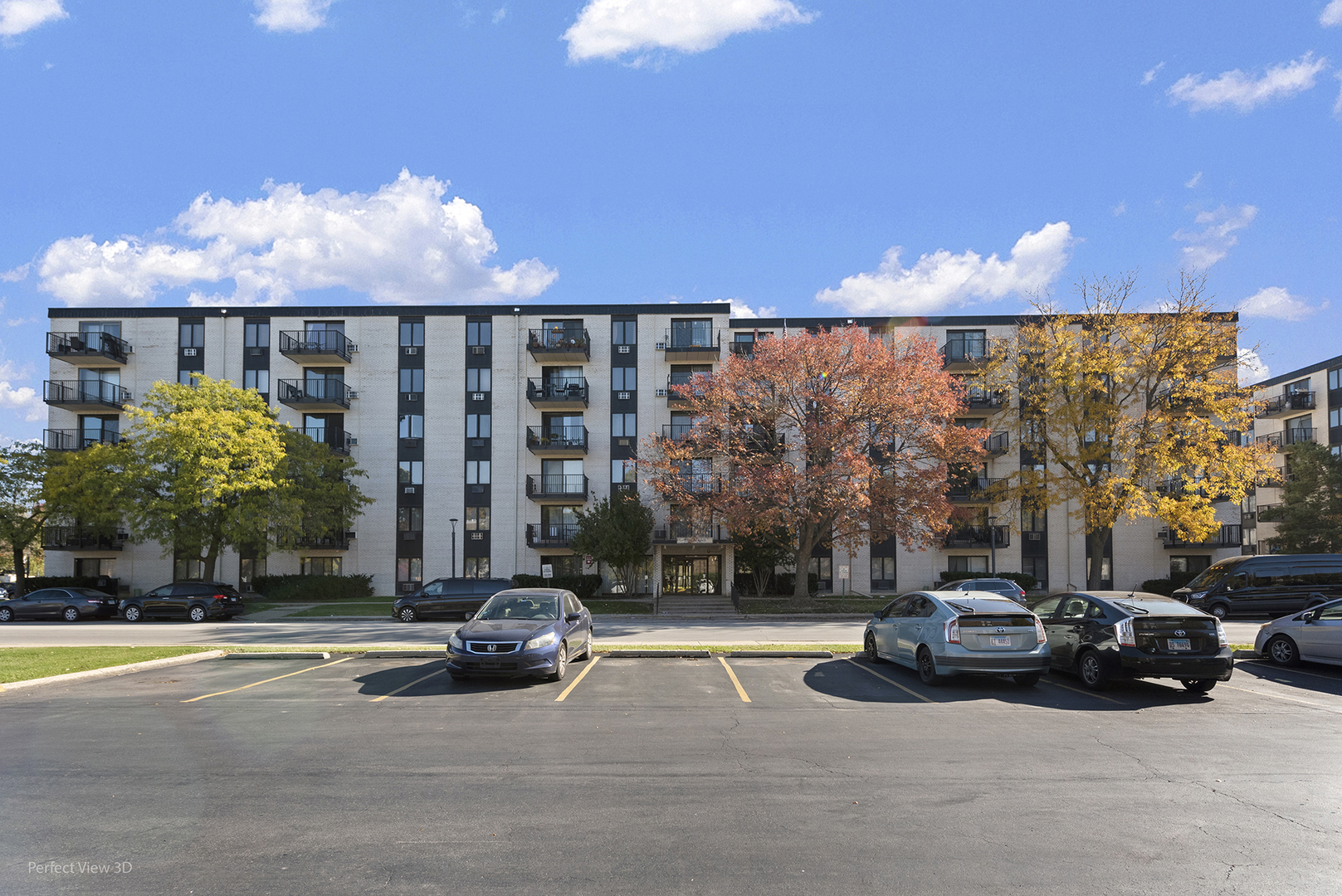 9701 North Dee Road, Unit 5E Niles, IL 60714 - Photo 17 of 18 a view of a cars parked in front of a building