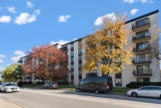 a view of a cars parked in front of a building